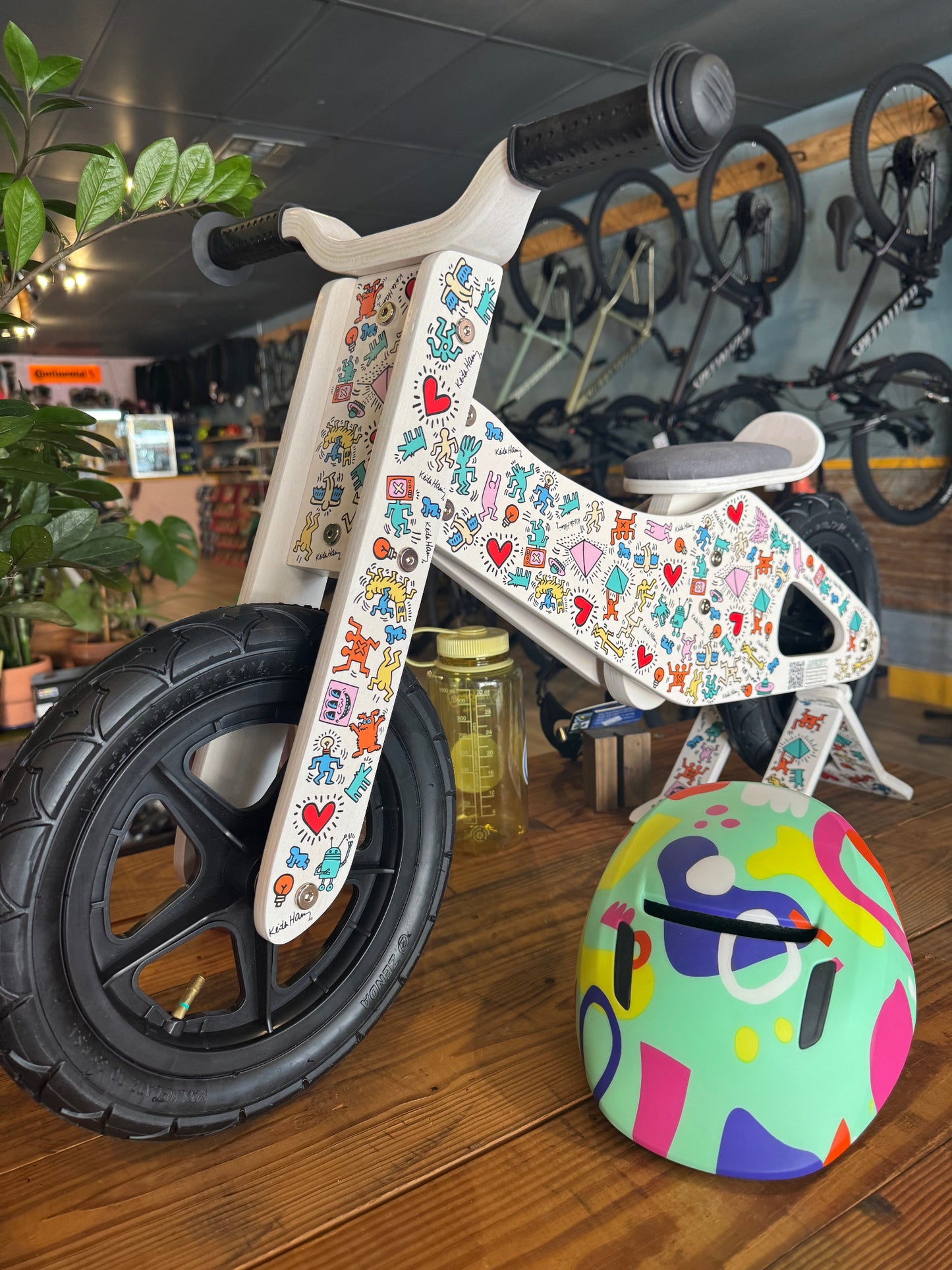 Keith Haring kids balance bike side view with colorful graphics