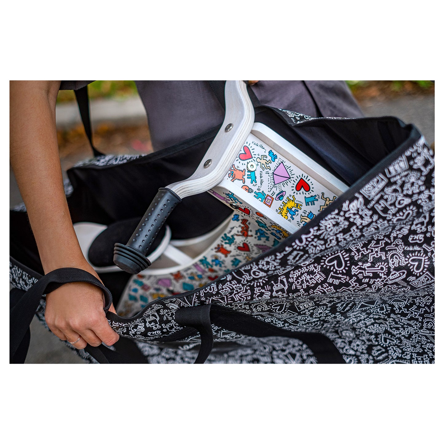 Close up of Keith Haring push bike inside Keith Haring x Affinity XXL tote bag