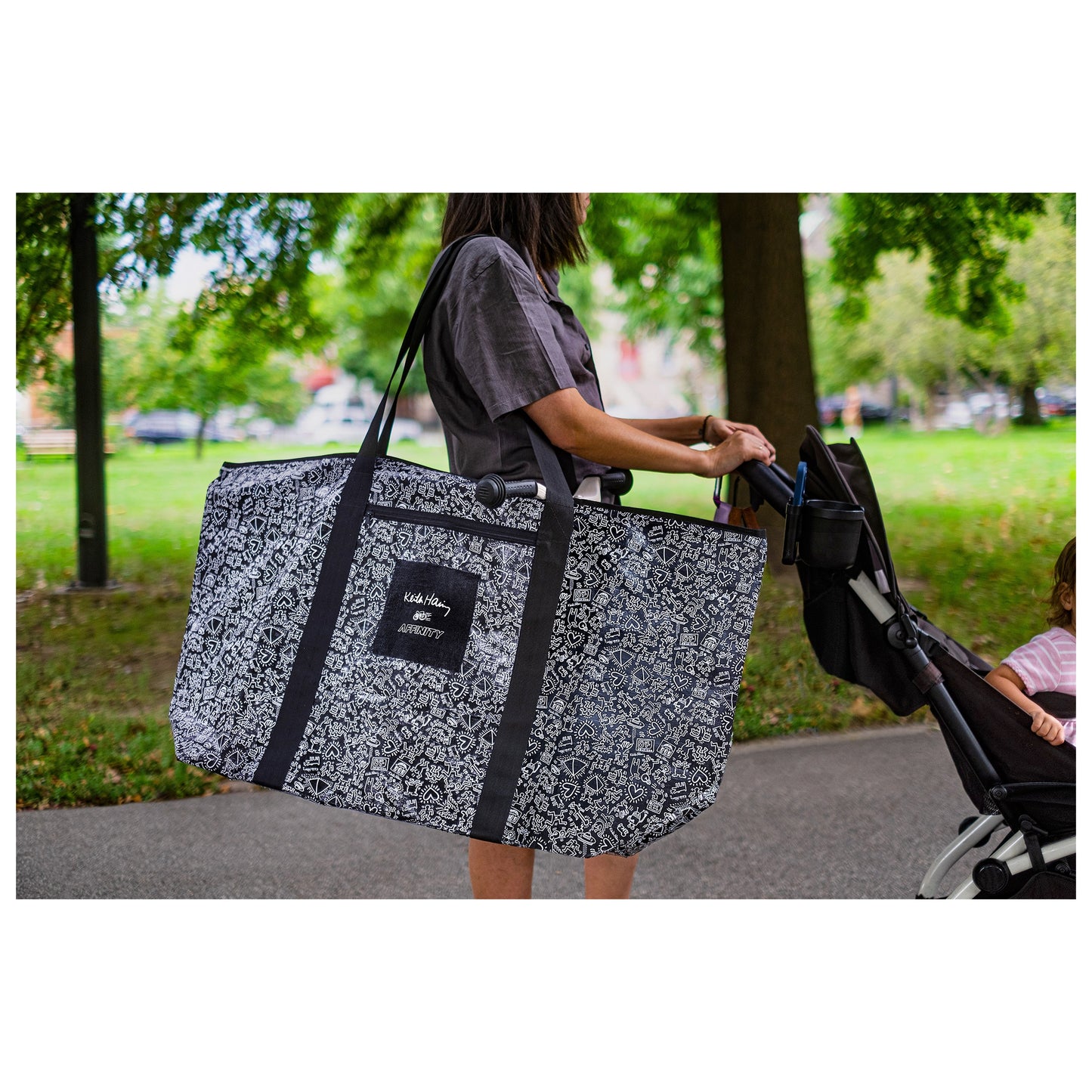 Woman wearing Keith Haring x Affinity XXL Tote Bag – Limited Edition on shoulder.