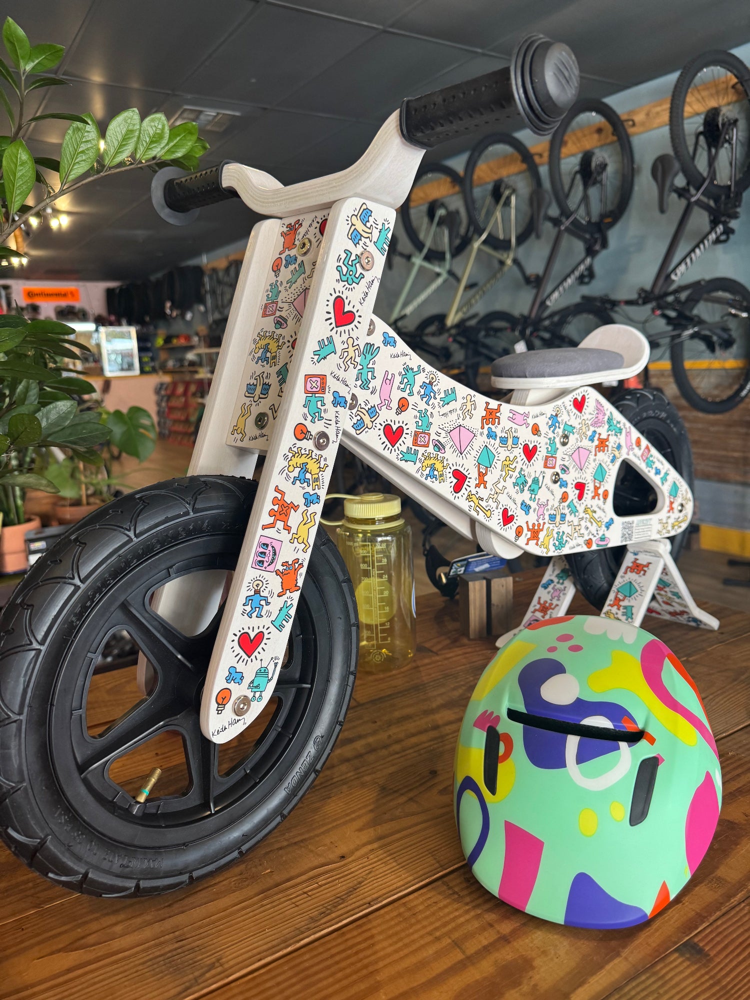 Keith Haring kids balance bike side view with colorful graphics