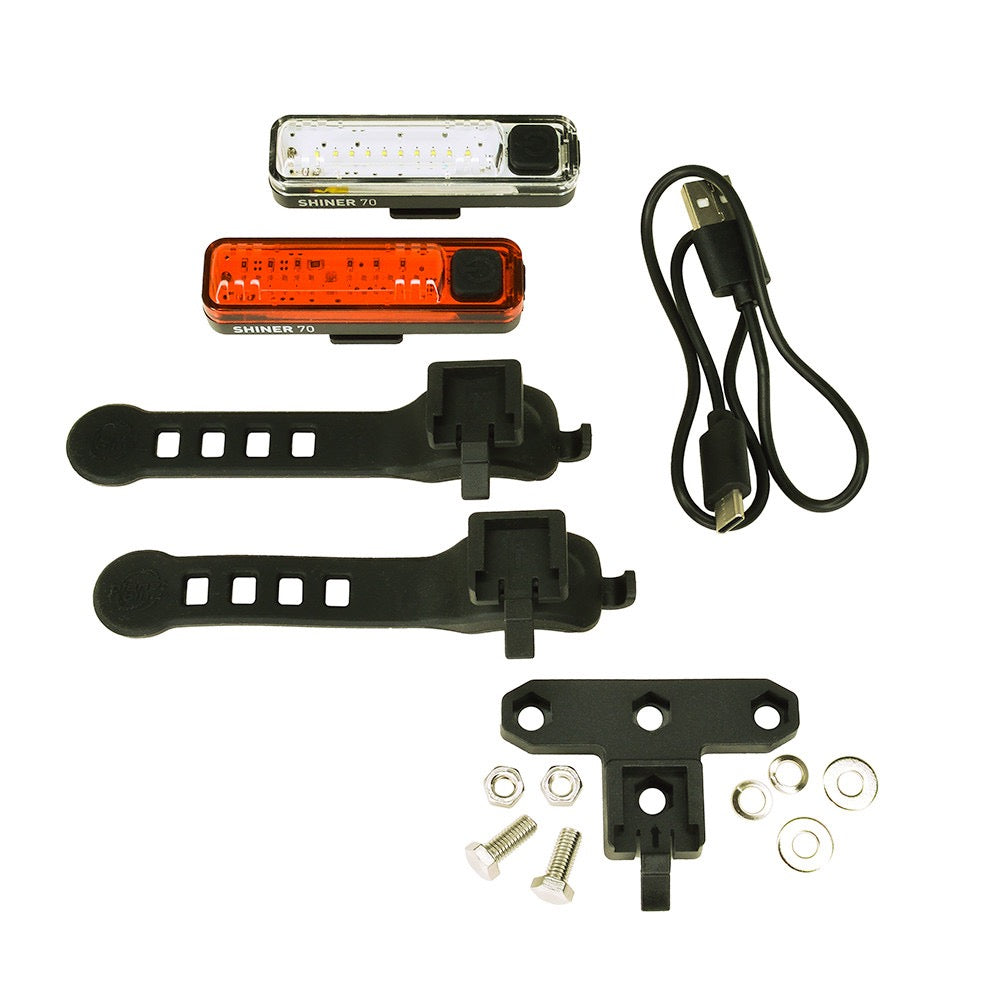 Planet Bike Shiner 70 rechargeable bicycle light kit with lights, mounting brackets, and connectors on a white background