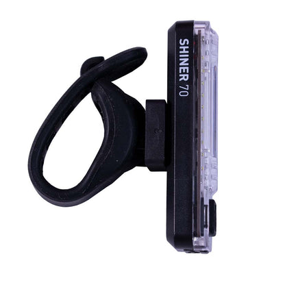 Planet Bike bicycle light with 'SHINER 70' branding on a white background, showing rubber mounting bracket.