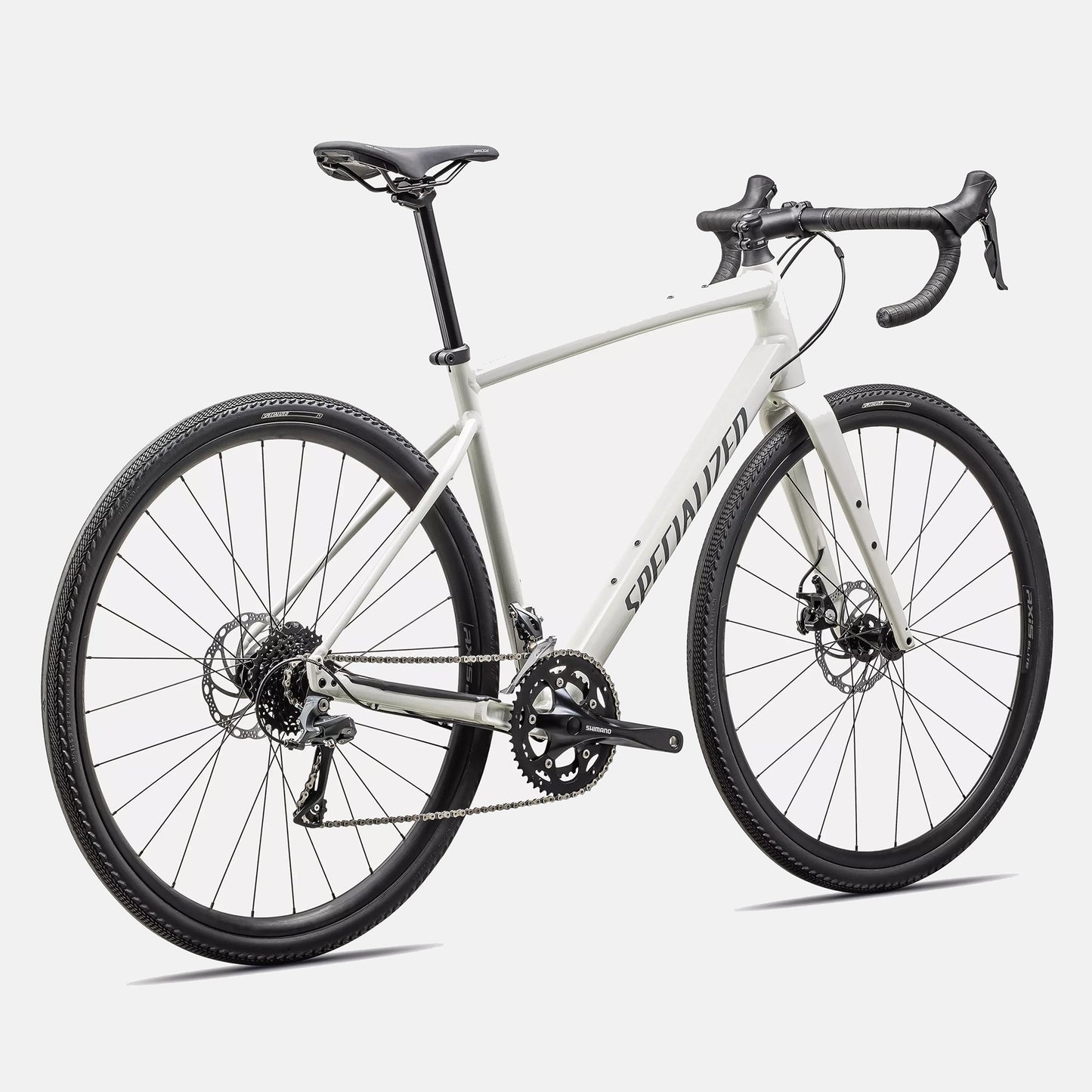 Specialized Diverge E5 Dune White rear 3/4 view showing Shimano drivetrain, gravel tires and hydraulic disc brakes