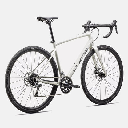 Specialized Diverge E5 Dune White rear 3/4 view showing Shimano drivetrain, gravel tires and hydraulic disc brakes